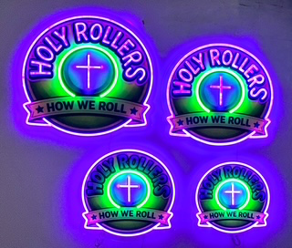 Holy Rollers LED neon sign glowing in purple and green